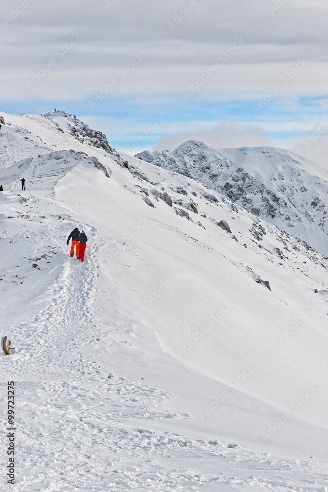 People climbing in Kasprowy Wierch in Zakopane on Tatras in winter