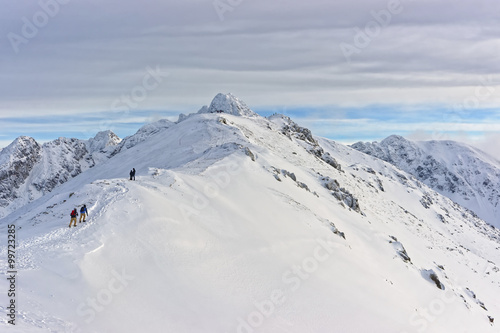 People climbing in Kasprowy Wierch in Zakopane on Tatras in winter © Roman Babakin