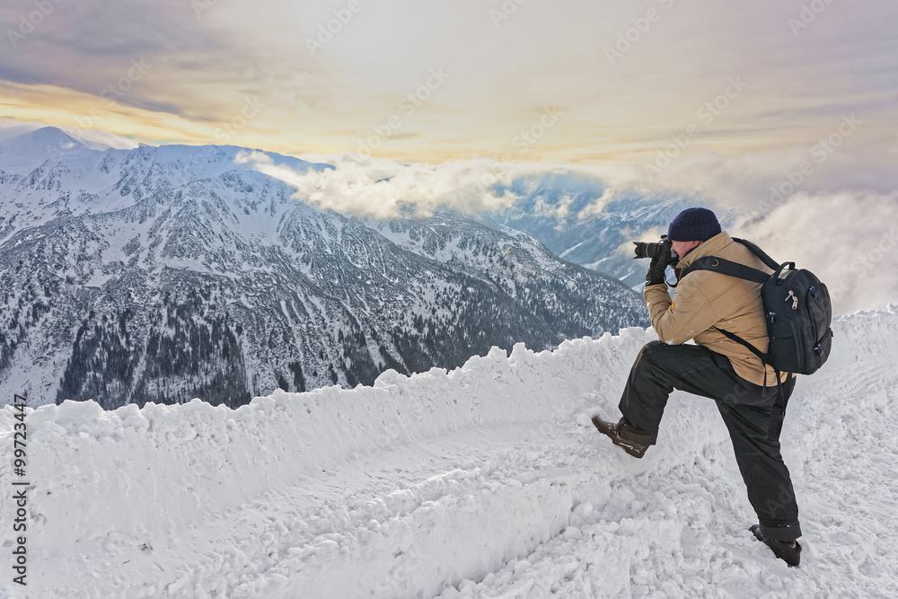 Man taking photos in Kasprowy Wierch of Zakopane in Tatras