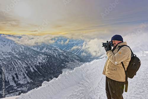 Man taking photos in Kasprowy Wierch in Zakopane in Tatras