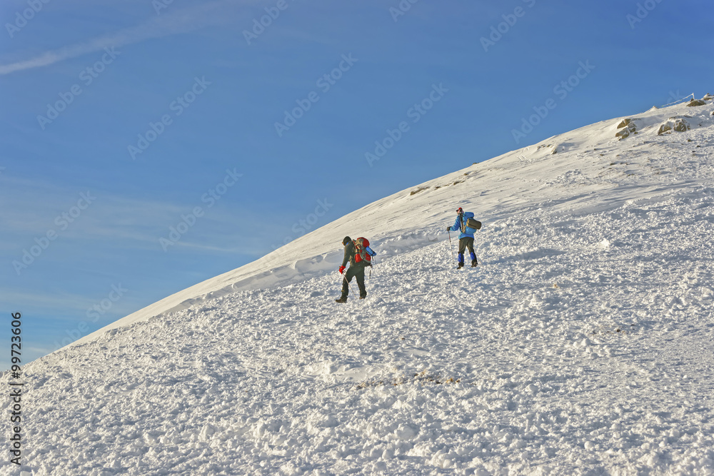 People climbing atop of Kasprowy Wierch in Zakopane in winter