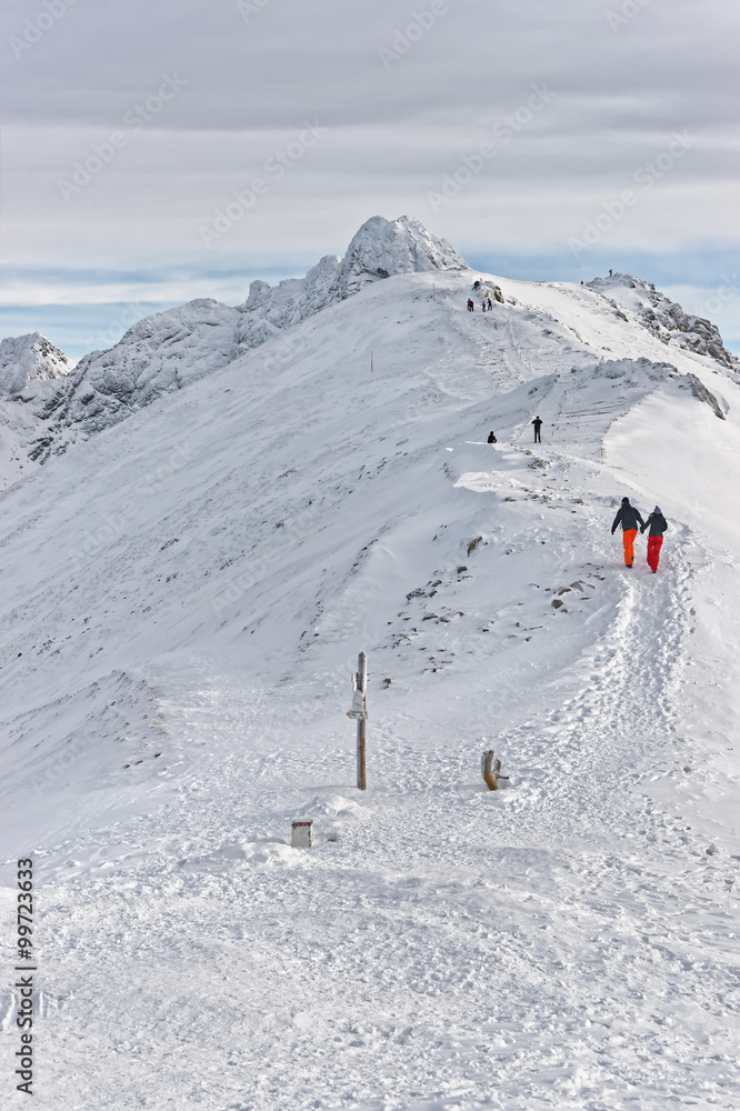 People climbing in Kasprowy Wierch of Zakopane on Tatras in winter