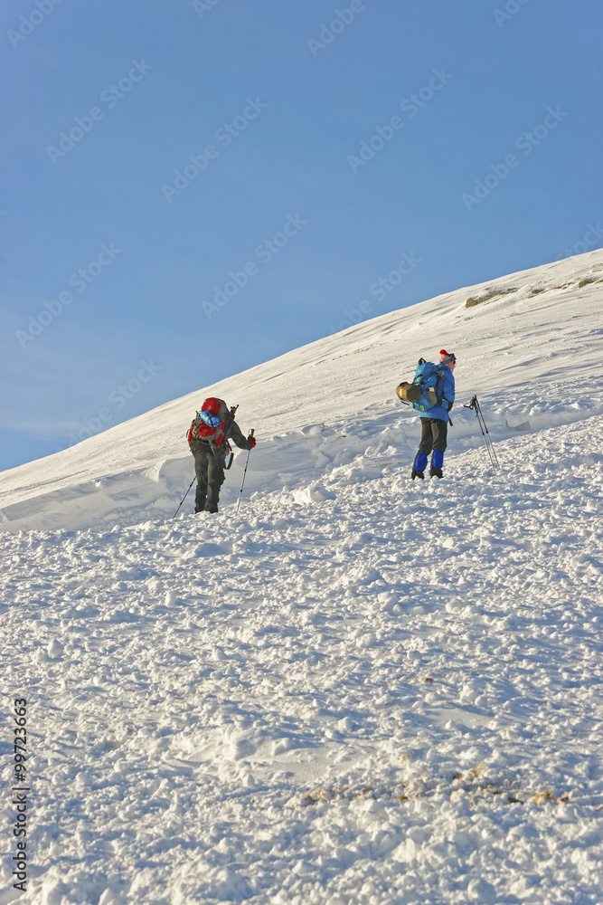 People climbing on top of Kasprowy Wierch in Zakopane in winter