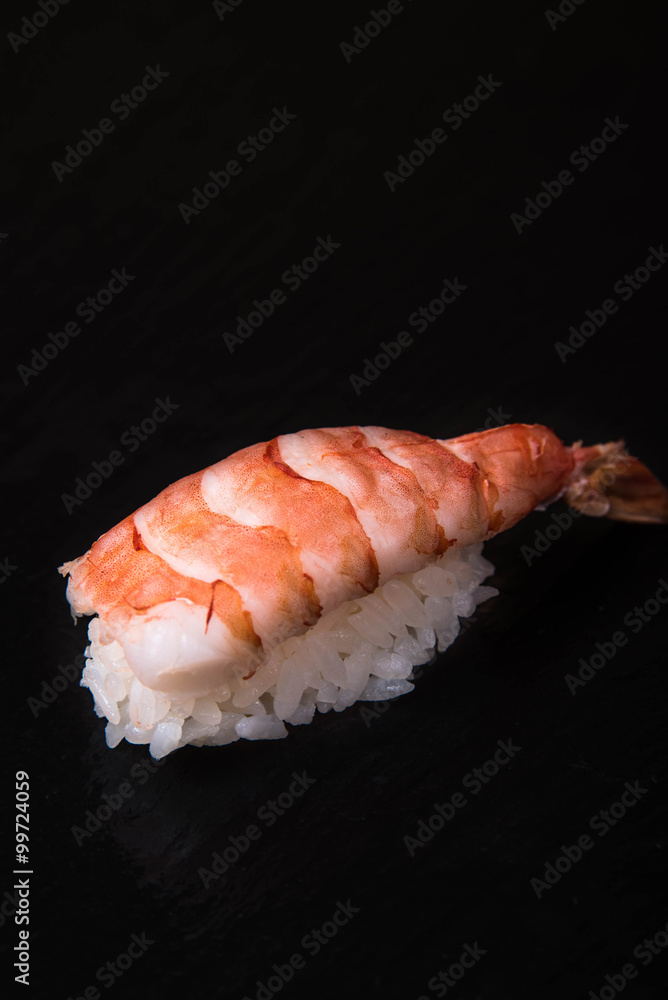 Nigiri sushi on a black background, Japanese cuisine Nigiri sushi on a black background, Japanese cuisine