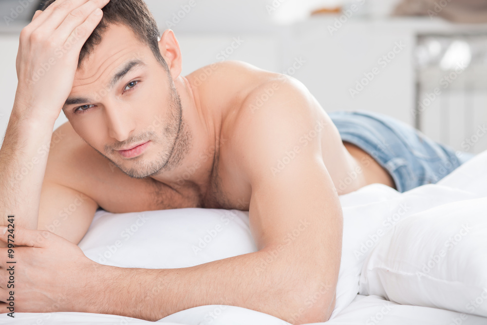 Handsome fit man is relaxing at home Handsome fit man is relaxing at home