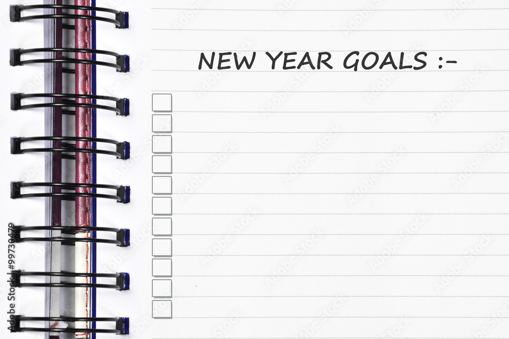 new year goals words on spring note book