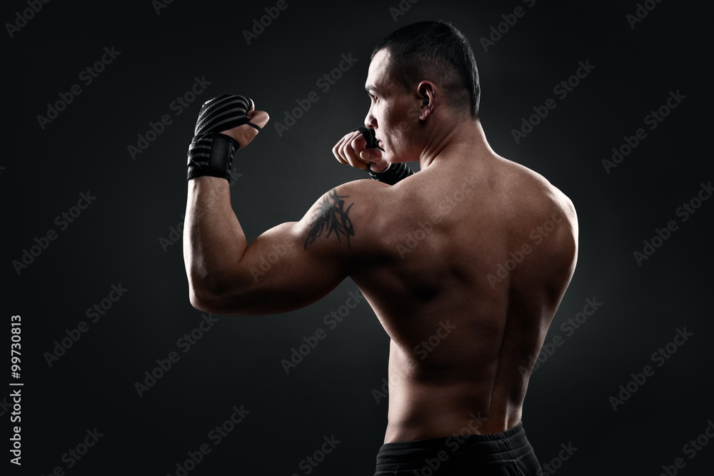 Fighter boxer on black background