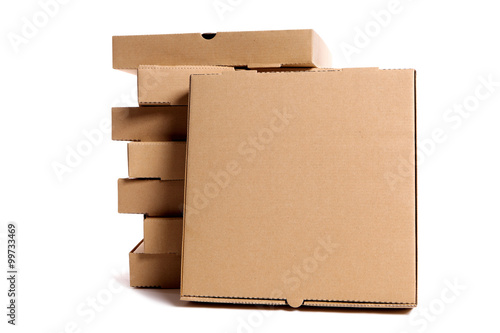 Stack of brown pizza boxes with display box isolated on white background photo