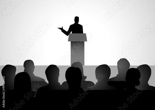 Man Giving A Speech On Stage