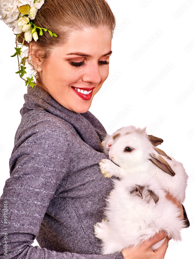 Portrait of a young woman holding pet rabbits. Portrait of a young woman holding pet rabbits.