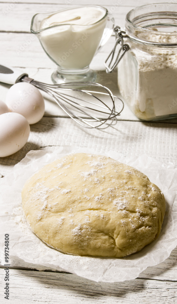 Preparation of the dough. The prepared dough with the ingredients - eggs, flour, sour cream and whisk . Preparation of the dough. The prepared dough with the ingredients - eggs, flour, sour cream and whisk .