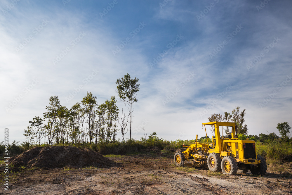 Wheel loader Excavator in the field with clear bule sky Wheel loader Excavator in the field with clear bule sky