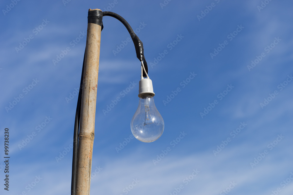 Old light bulb on Bamboo with Blue Sky Old light bulb on Bamboo with Blue Sky