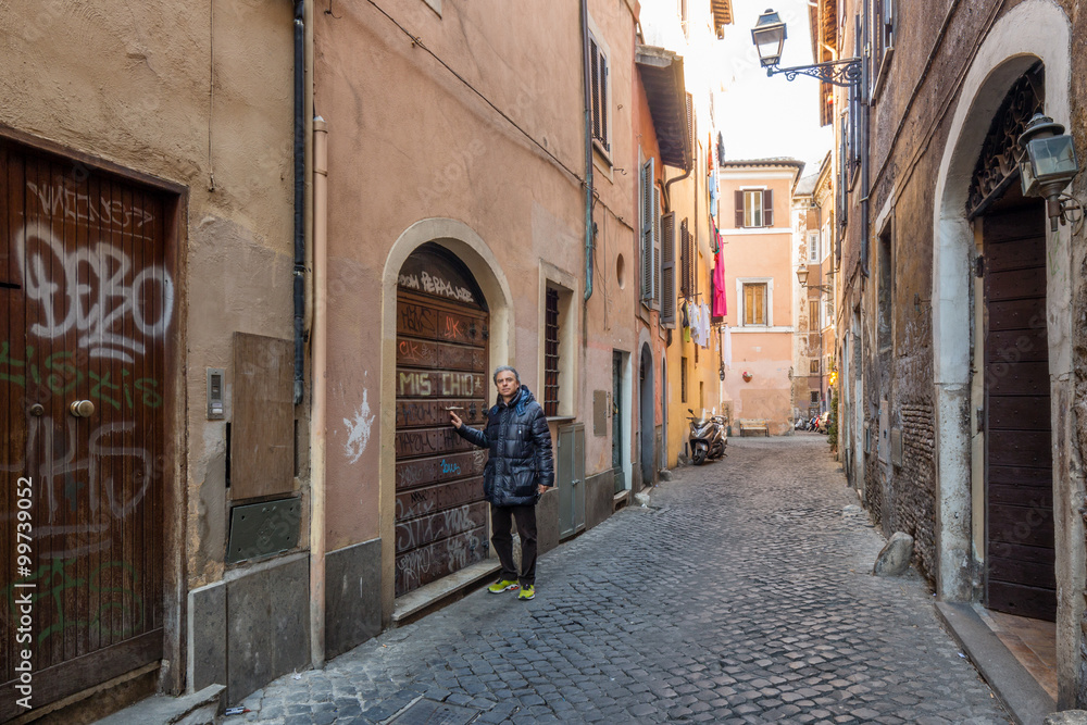 man in ancient streets and alleys of Rome