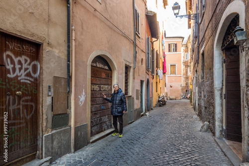man in ancient streets and alleys of Rome