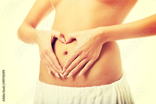 Wallpaper Mural Female making heart shape on belly  Torontodigital.ca