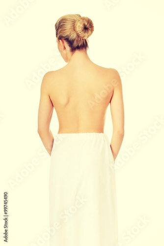Back of young woman after bath or spa.