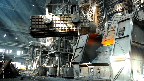 steel smelting in furnace at metallurgical works photo