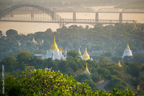 the bridge across Irrawadee river and the old pagodas in Sagaing Area. Mandalay. Myanmar photo