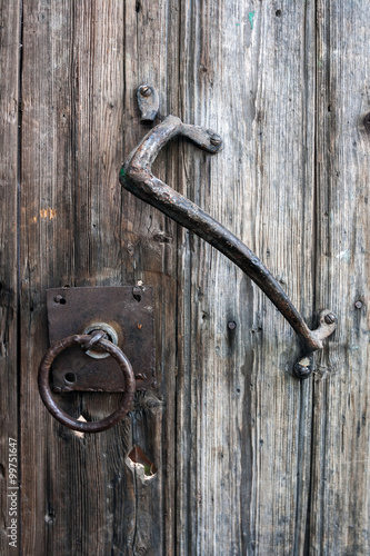 old wooden door with wrought iron handle