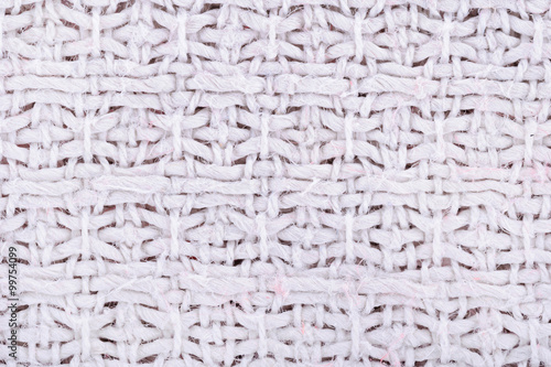 Fabric texture. Macro. Cross-stitch pattern textile. For the background.  Knitting Pattern with Purls and Knits.