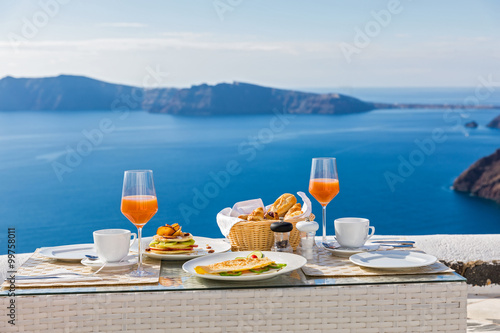 Fototapeta Naklejka Na Ścianę i Meble -  Breakfast at a table overlooking the sea