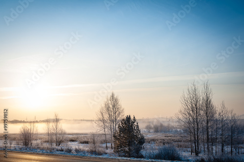 Snow field and road and sunrise