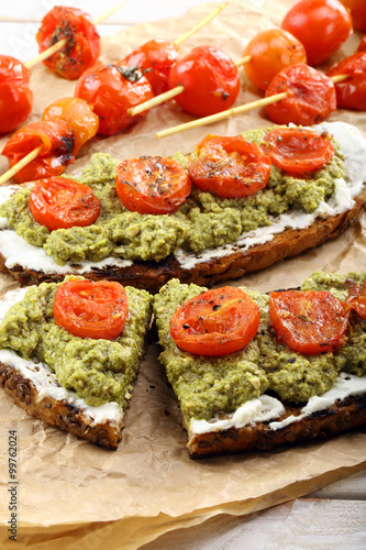 Sandwich with white cheese pesto and roasted tomatoes
