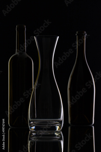 Empty glass and bottles