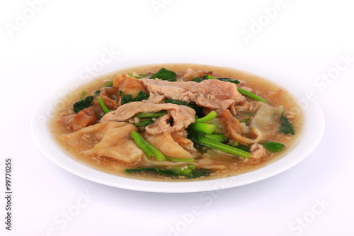 The Best Thai Dishes, Wide Rice Noodles Pork in Thick Gravy, Thai Noodles Topped with Pork: Chinese and Thai Style food called "Rad Na"