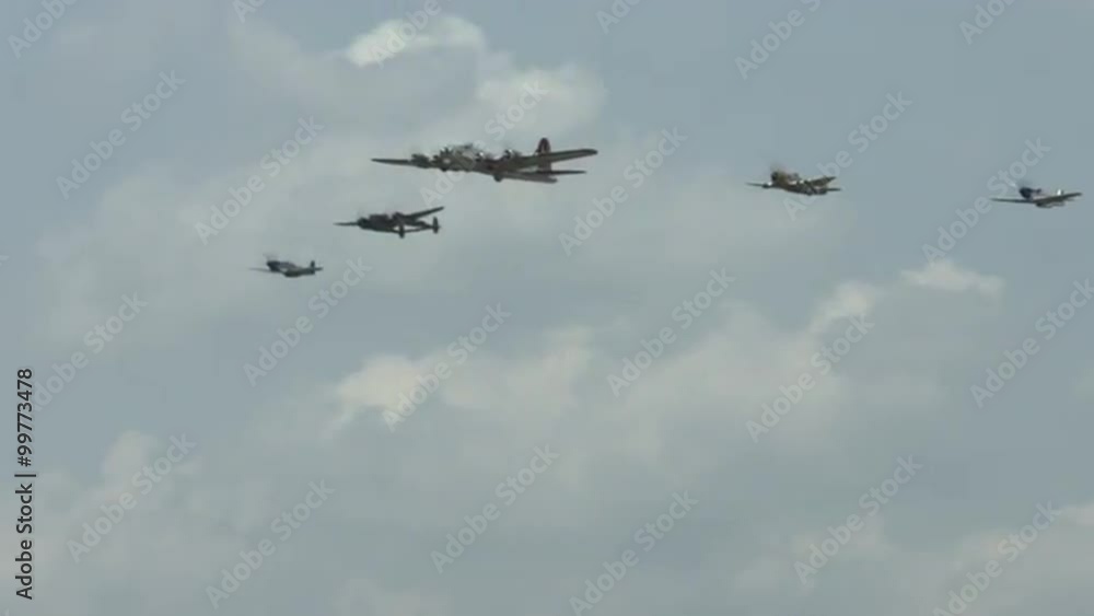 B-17 Flying Fortress leads a formation of four World War II fighter planes, including a P-63 Kingcobra, a P-38 Lightning, and two P-51 Mustangs. Recorded in 4K, ultra high definition. B-17 Flying Fortress leads a formation of four World War II fighter planes, including a P-63 Kingcobra, a P-38 Lightning, and two P-51 Mustangs. Recorded in 4K, ultra high definition.