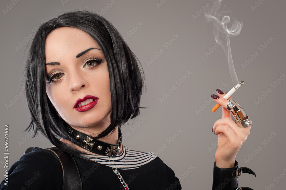 Fototapeta premium Woman with cigarettes / Punk woman smoker with six cigarettes