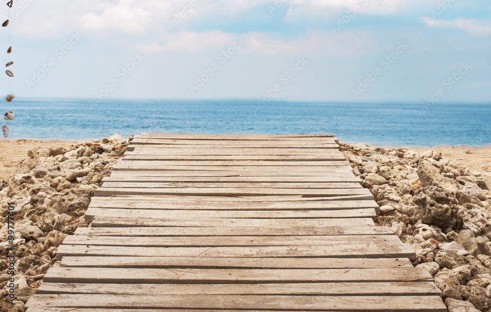 Fototapeta premium Wooden platform on beach