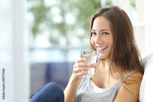 Slika na platnu Girl drinking water at home