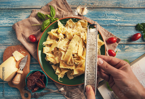 Fotografie Italian pasta pappardelle finishing cooking process