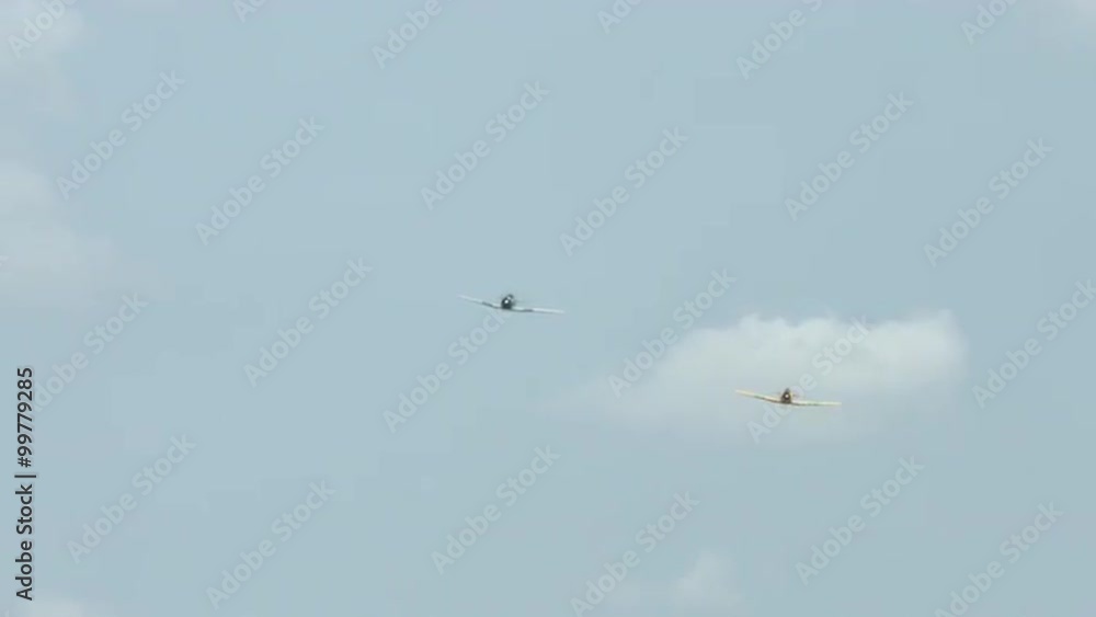 Two T-6 Harvard trainers (also known as a Texans) flying in formation. Used by Canada and the United States for pilot training. Recorded in 4K, ultra high definition. Two T-6 Harvard trainers (also known as a Texans) flying in formation. Used by Canada and the United States for pilot training. Recorded in 4K, ultra high definition.