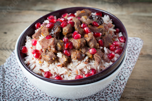 beef stew with white rice and pomegranate