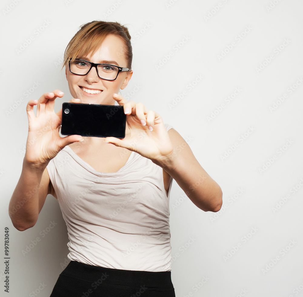 Fototapeta premium businesswoman holding mobile phone