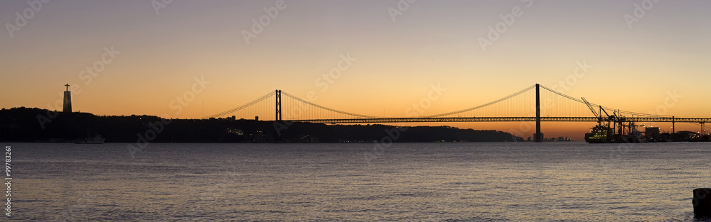 Sunset view of The 25 de Abril Bridge in Lisbon, Portugal