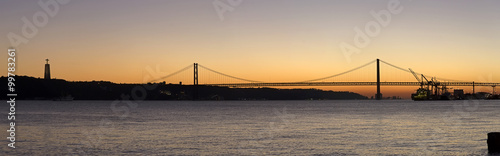 Sunset view of The 25 de Abril Bridge in Lisbon, Portugal