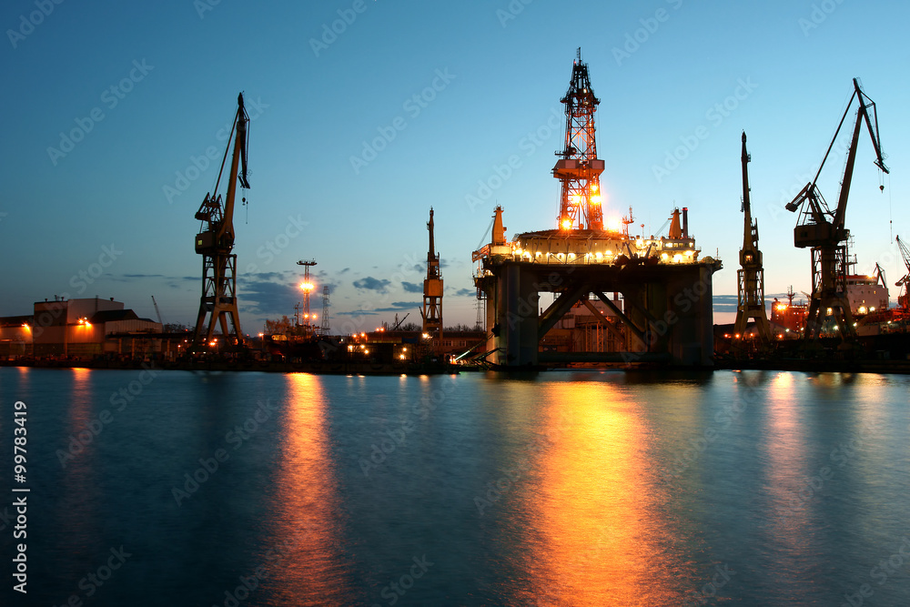Night view of the drilling platform standing in the yard during renovation