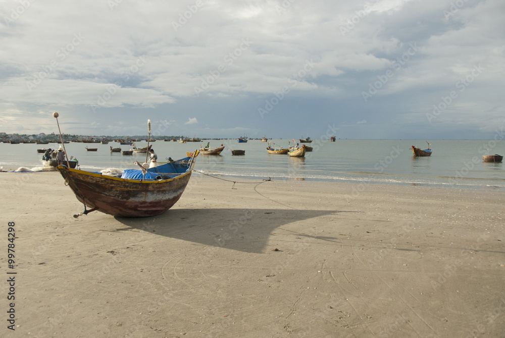 Traditional fishing boat on a beach of Mui Ne, Vietnam.