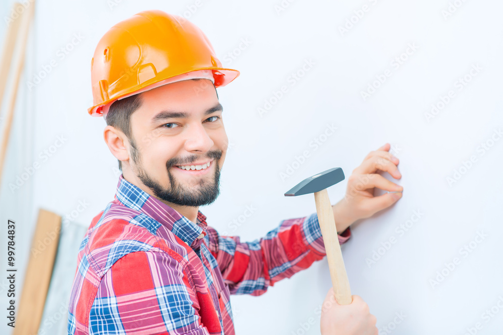 Pleasant man knocking in the nail Pleasant man knocking in the nail