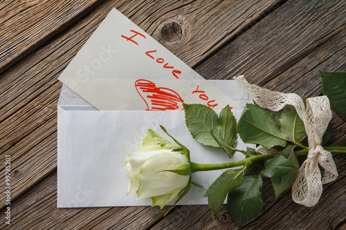 White rose with letter