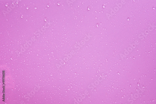 water drops on pink background © Achira22