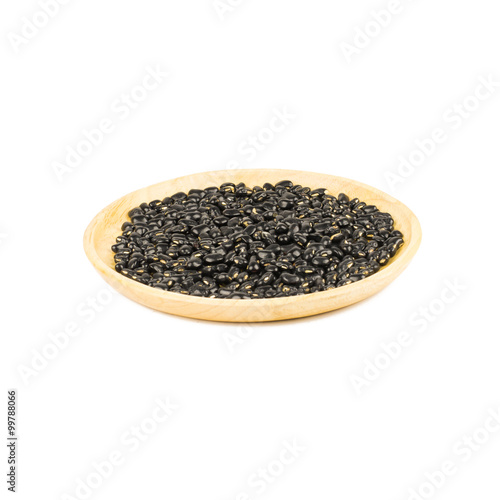 Seed black beans in wood cup isolated on white
