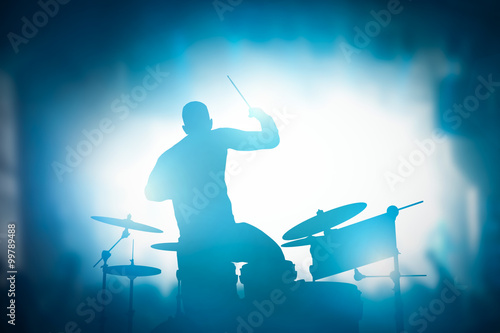 Canvas Print Drummer playing on drums on music concert. Club lights