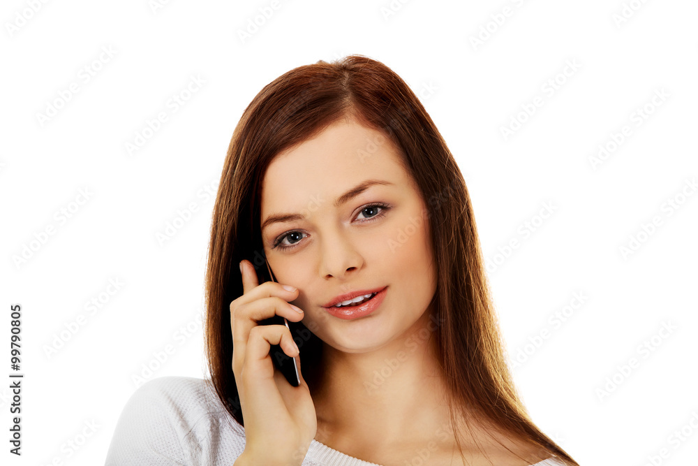Beautiful student woman talking through a mobile phone Beautiful student woman talking through a mobile phone