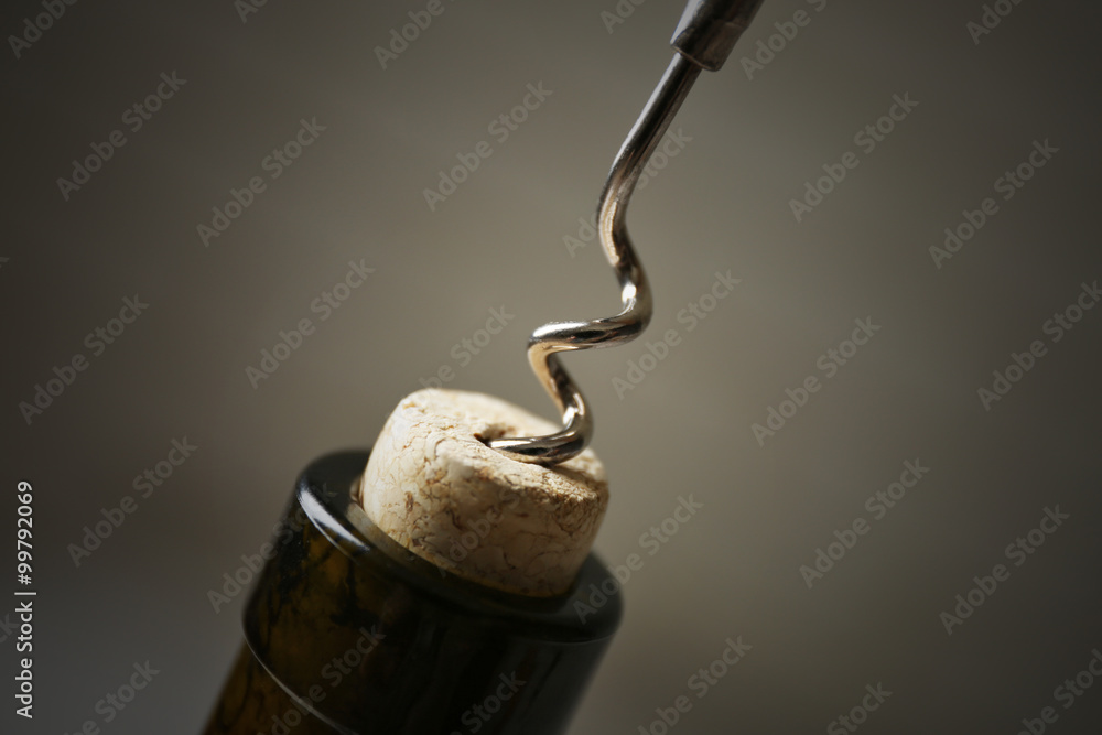Opening bottle of wine on a light background Opening bottle of wine on a light background