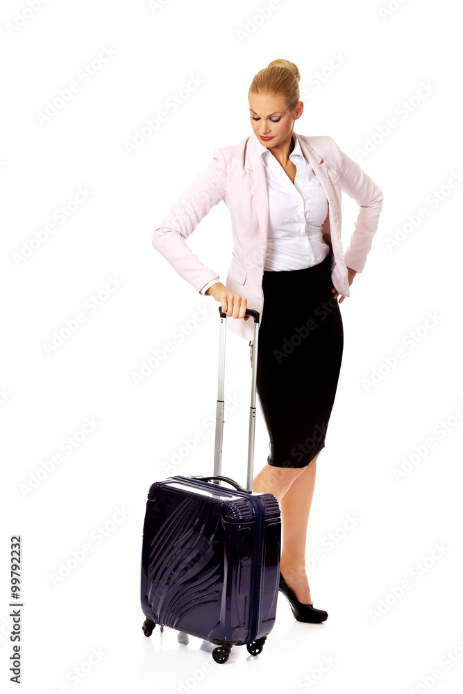 Young business woman waiting for travel with suitcase Young business woman waiting for travel with suitcase